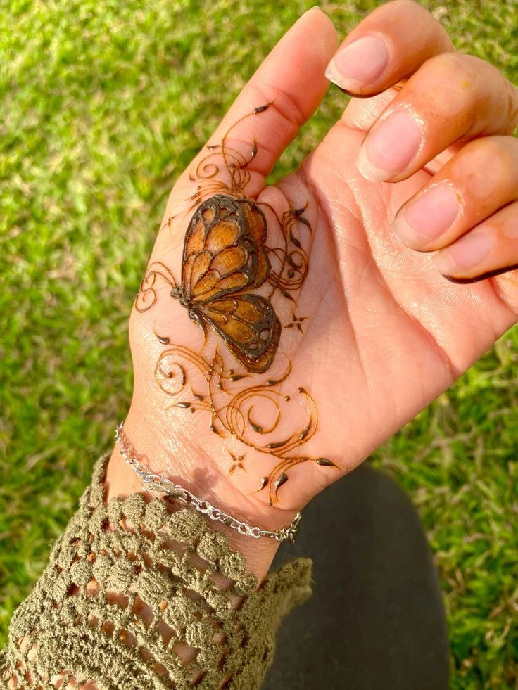 beautiful simple butterfly design with curves mehndi design
