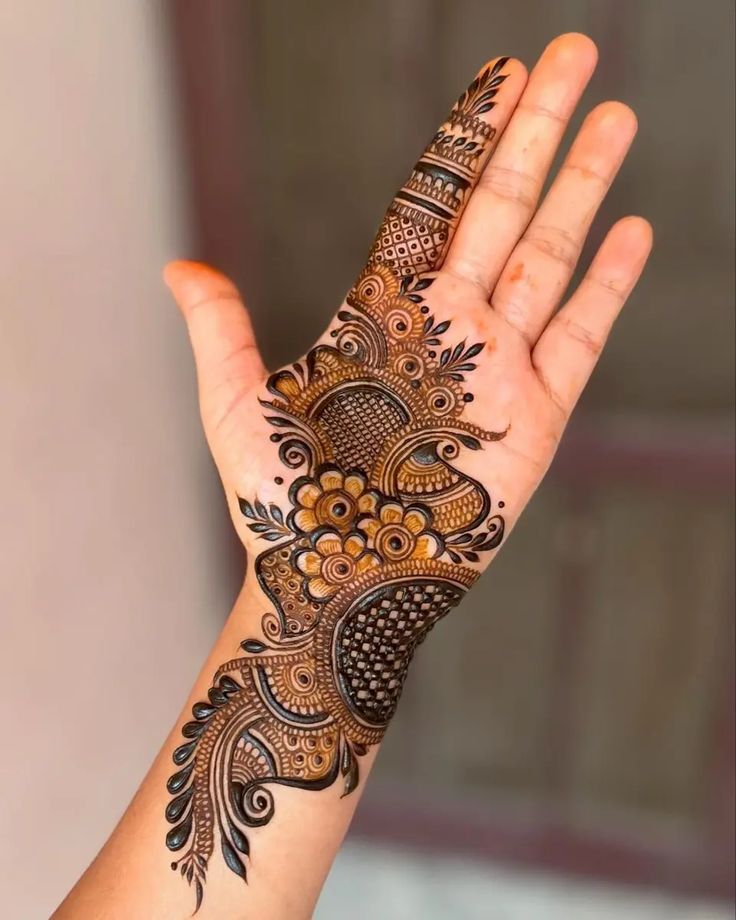 Intricate floral patterns adorning the left hand with elegant curves and petal motifs