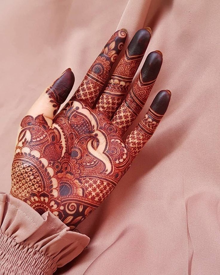 Stylish front hand design with lace netting, spirals, and floral elements.