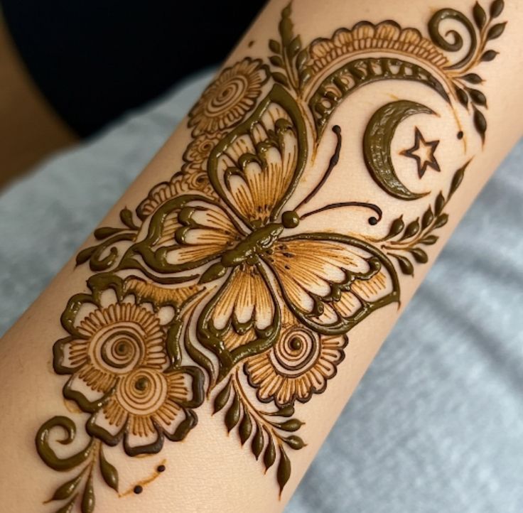 Minimalistic butterfly mehndi design with delicate strokes